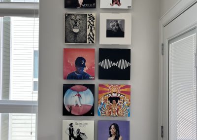 Loft bedroom with pop art gallery wall, skylight, and modern furnishings